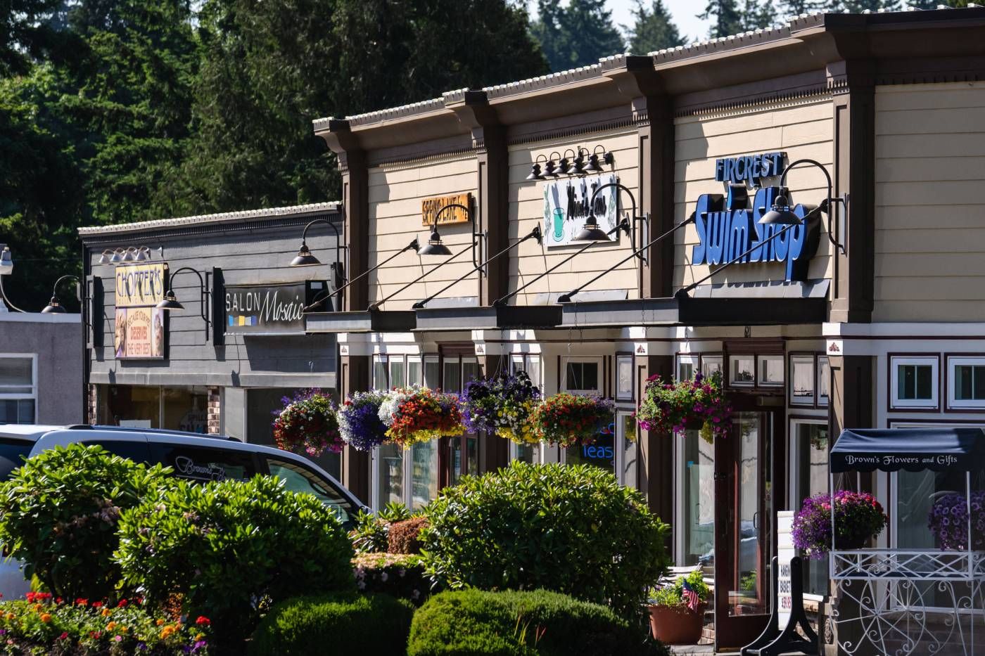 Storefronts with hanging flower baskets in Fircrest, Washington